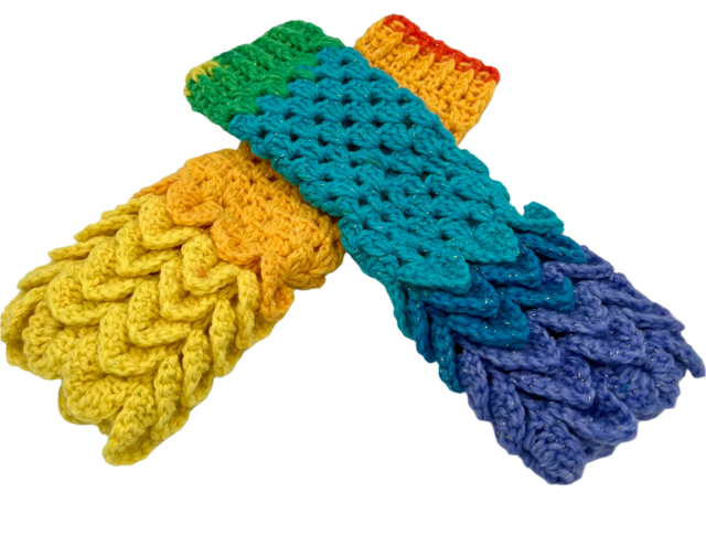 A pair of crocheted fingerless gloves using the crocodile stitch. The color is rainbow themed, nicknamed Comet.